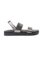 Black sandal with metallic straps on a white background