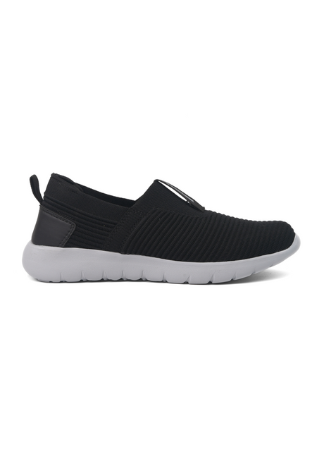 Black slip-on sneaker with white sole on a white background