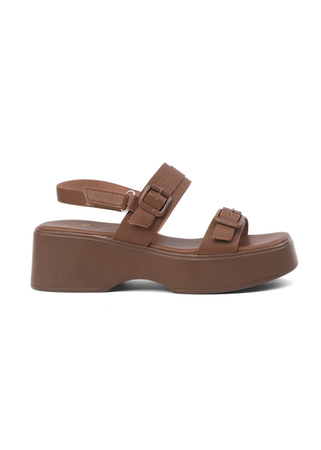 Brown sandal with platform sole on a white background