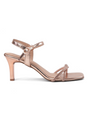 Rose gold high-heeled sandal on a white background