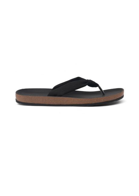 Black sandal with a brown sole on a white background