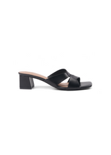Black sandal with a block heel on a white background