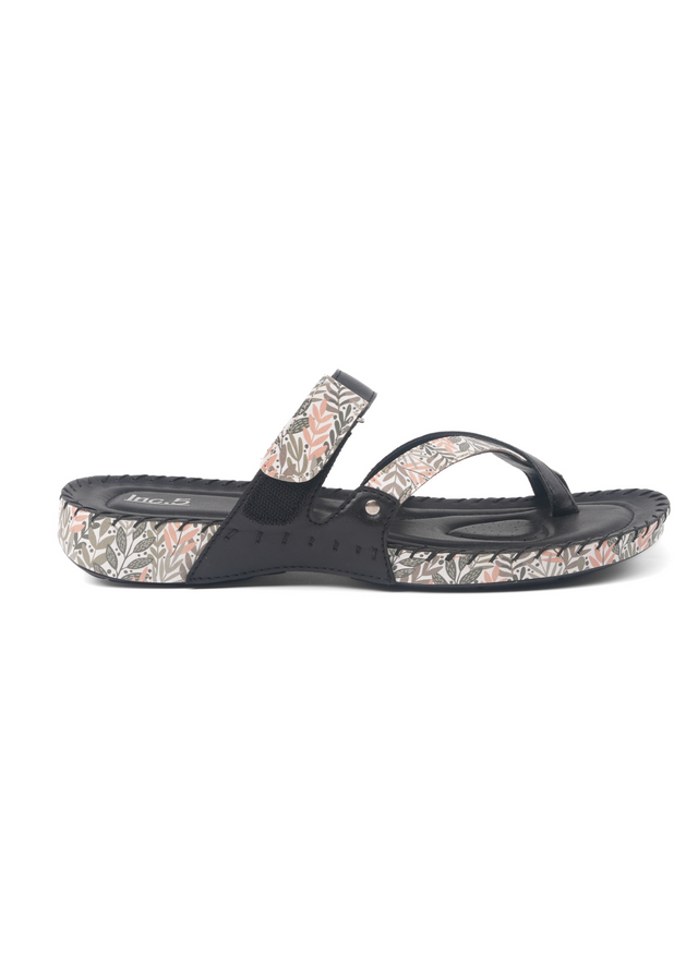 Black sandal with floral pattern on a white background