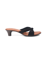 Black sandal with a brown heel on a white background