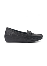 Black loafers with textured sole on a white background
