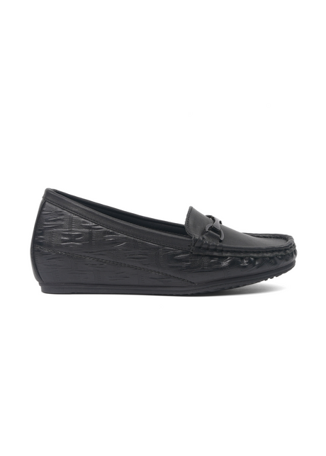 Black loafers with textured sole on a white background