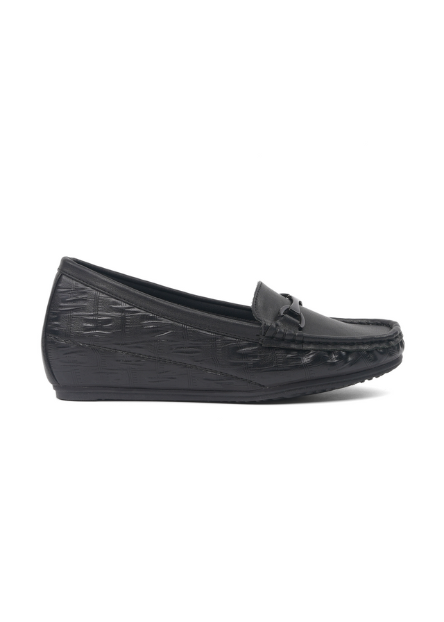 Black loafers with textured sole on a white background