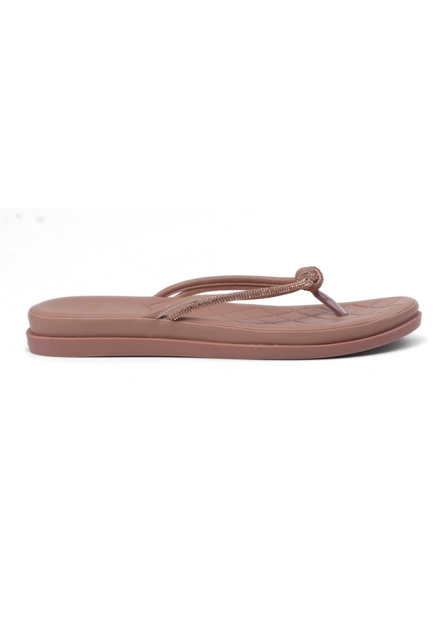 Pink sandal with a thong design on a white background