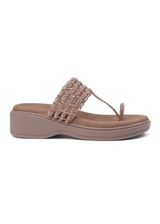 Brown sandal with a decorative strap on a white background