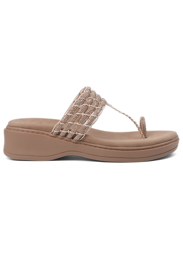 Beige sandal with a decorative strap on a white background